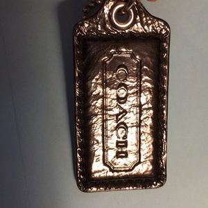 Coach hang tag. Black leather look.